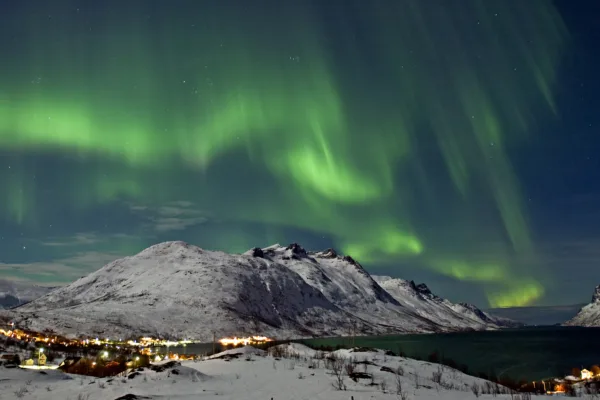 Northern lights over the Ersfjord in Tromso Bjorn Jorgensen Visit Norway com